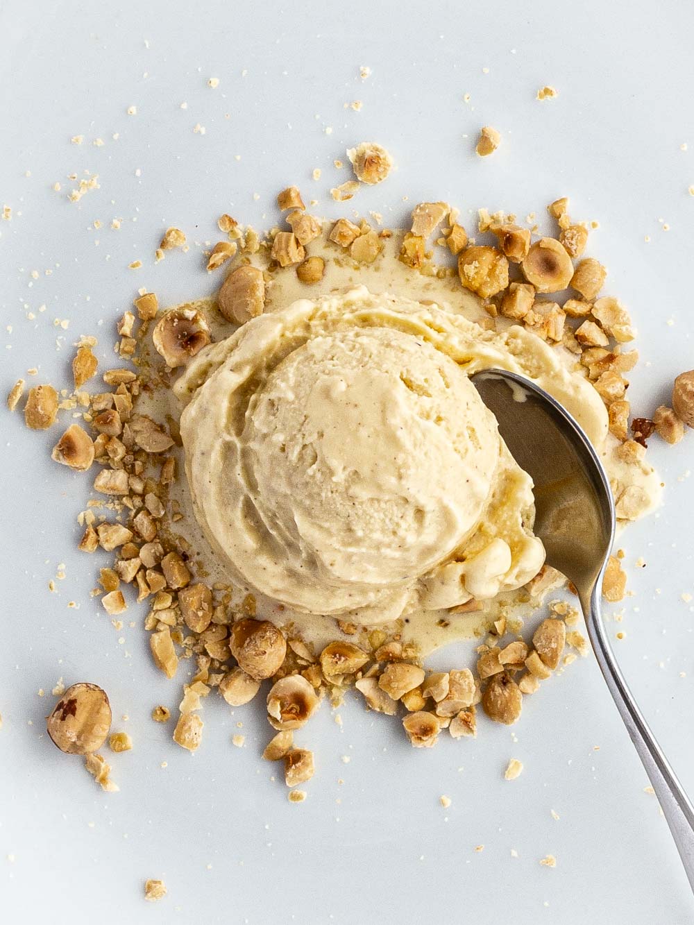 Taking a spoon of hazelnut ice cream