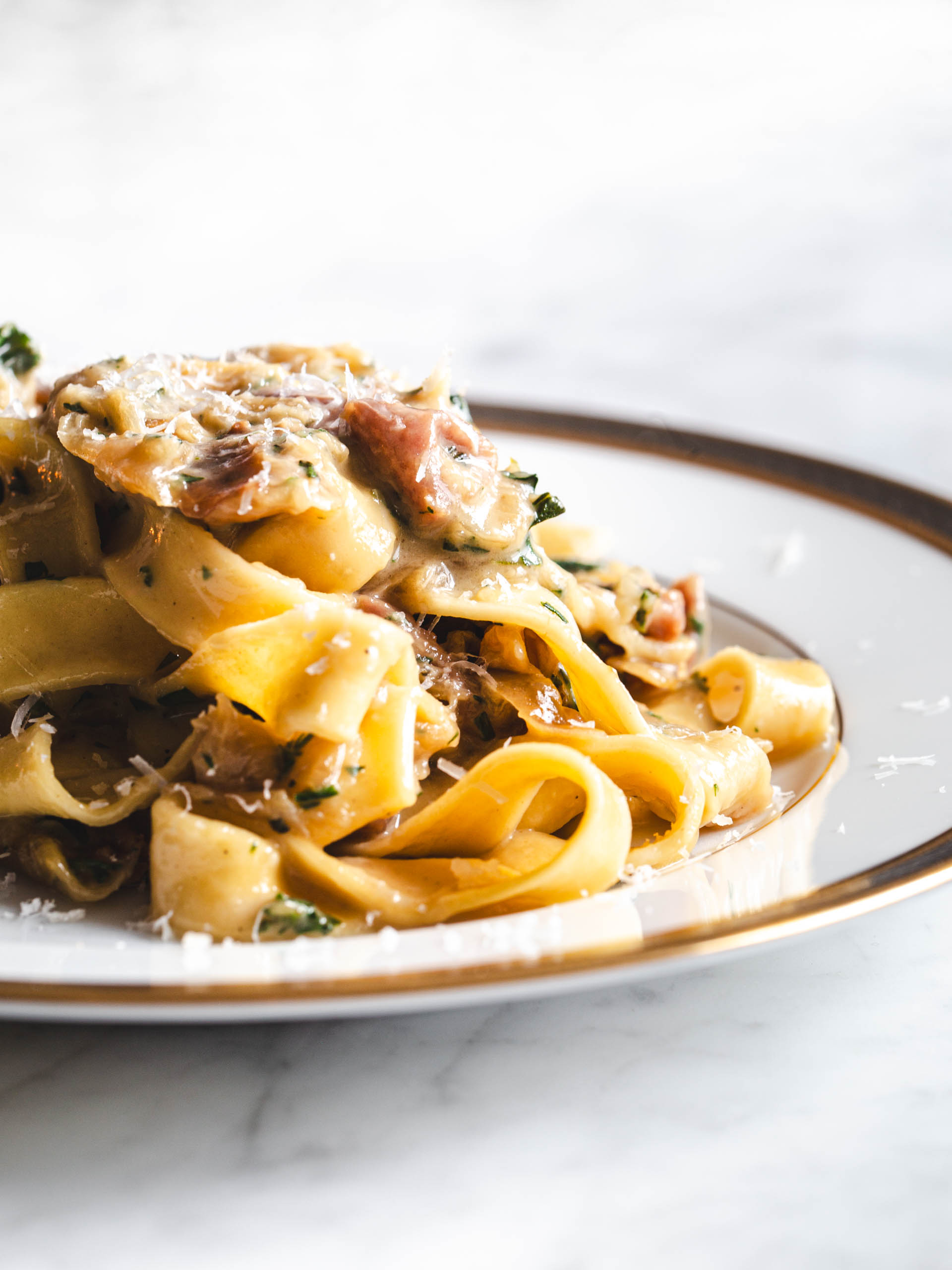 Plate of caramelized onion pasta.